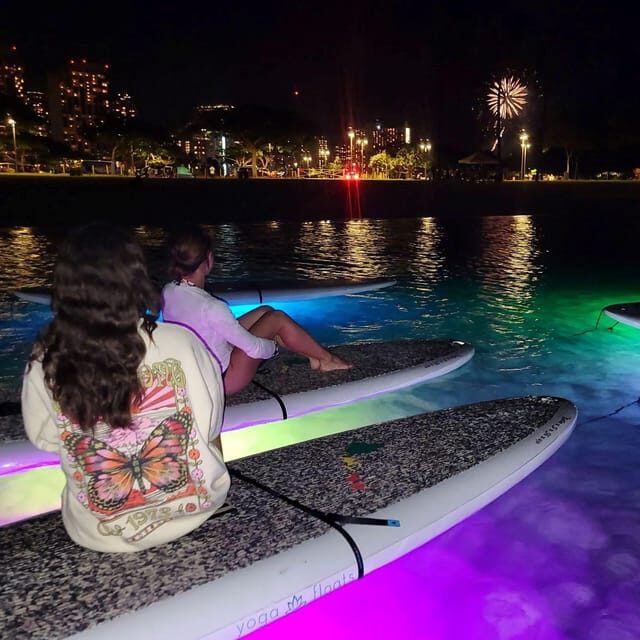Honolulu: Fireworks Glow and Flow Yoga Class - The LED-lit SUP and the skyline shift from dusk to night