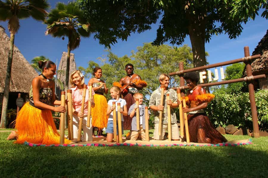 Oahu: Islands of Polynesia and "HA: Breath of Life Show" - Fiji village: derua bamboo instrument, temporary tattoo, and a 6-story temple tour
